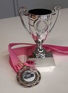 Vuoden Urheilijan pokaali ja Joukkuekaverin mitali.